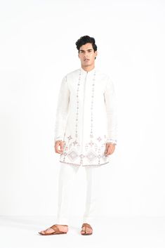 Ivory Phulkari inspired Nehru Jacket with pipe, cutdaana and thread work embroidery with same coloured kurta with embroidery detail on the chest and sleeve. this set in made in linen Satin, Paired with Ivory slim fit Pant Pajama. Color of
the actual garment may vary due to lighting conditions during the shoot.

Size Chart For Men





	
	
					Men's Size Chart
		

		
		
						
				Size Chart For Men
				Custom Size Measurement Guide
			
			
				
				
				Custom Size Measurement Guide
1. Take you Festive Long Sleeve Floral Bandhgala, Elegant Embroidered Nehru Jacket For Traditional Ceremonies, Festive Off-white Bandhgala With Intricate Embroidery, Ceremonial Off White Kurta With Resham Embroidery, Resham Embroidery Bandhgala Straight Kurta, Off White Bandhgala With Chikankari Embroidery, Festive Long Sleeve Bandhgala With Multicolor Embroidery, Designer Floral Embroidered Kurta For Transitional Season, Traditional Off White Bandhgala With Chikankari Embroidery