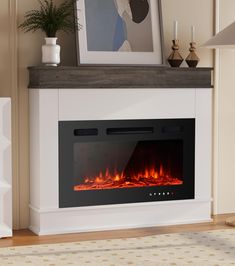 a white fireplace with an electric fire in it