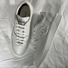 Chanel White Sneakers, Similar To Air Force 1. I'm Usually Eu 38 (Ggdb), But Chanel Runs 1/2 Small So These Are 38.5 Luxury Calf Leather Sneakers For Streetwear, Designer Low-top Sneakers With Laces, Luxury Low-top Sneakers With Branded Insole, Luxury Streetwear Sneakers With Round Toe, Luxury Round Toe Sneakers For Streetwear, Designer Low-top Custom Sneakers With Rubber Sole, Designer Sneakers With Laces, Designer Sneakers With White Sole And Laces, White Luxury Low-top Sneakers