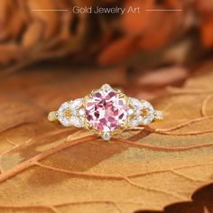 💎 Stone Specifications: 🌟 Main Stone: Pink Sapphire 🌟 Side Stones: Moissanite 🌟 Size of Main Stone: 6.5mm 🌟 Center Stone Carat: 1.5ct 🌟 Cut: Round cut 🔮 Materials Available: ＊ 925 Sterling Silver ＊ 925 Sterling Silver (Electroplated) ＊ 10K Gold ＊ 14K Gold ＊ 18K Gold ＊ Platinum 🎀 Contact us directly to customize your ring size or gemstone - bespoke services available upon request. 🎁 Packaging: Each ring is carefully placed in a beautifully curated gift box, ensuring a luxurious unboxing experience for your special moments. ◆Store Policies: ＊ 30 days Refund Guarantee ＊ Free Shipping ＊ Free Gift Box & Packing ◆Please contact us if you need these services: ＊ Engraving ＊ Metal Change ＊ Ring Resizing ＊ Custom order ◆Processing time: ＊ Items are subject to processing time of approx 1-3 w Rose Gold Topaz Ring With Accent Stones, Fine Jewelry Rose Gold Topaz Ring With Accent Stones, Exquisite Pink Round Diamond Ring, Elegant Pink Gold Rings With Accent Stones, Rose Gold Topaz Ring With Diamond Center Stone, Pink Gold Jewelry With Center Stone For Formal Occasions, Formal Pink Gold Jewelry With Center Stone, Round Pink Gold Diamond Ring, Pink Gold Round Diamond Ring