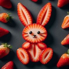 some strawberries are arranged in the shape of a bunny