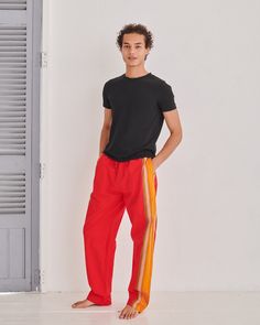 Our Classic Trousers have a relaxed, baggy fit that combines comfort and style, featuring our signature contrast stripe along the side of the leg. Equipped with three practical pockets, an elasticated waistband and a convenient drawstring, they are trousers you'll want to live in. Originally inspired by Kenyan Kikoy fabric.