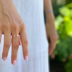 Sun and Moon Ring | Channel the power of the moon with this authentic moonstone ring. Handcrafted in 14K rose gold over sterling silver. It features an open shank sun & moon ring design and will be a wonderful addition to your ring collection. A luminous rainbow moonstone symbolizes inner growth and strength. Wear it to promote inspiration, intuition and empathy. Adjustable Moonstone Ring With Moon Phase, Minimalist Adjustable Bypass Ring, Adjustable Ring With Sun And Moon Design, Moon Phase Rings As Gifts, Adjustable Sun And Moon Design Rings, Elegant Rings With Moon Charm, Elegant Round Rings With Moon Charm, Delicate Adjustable Open Ring, Adjustable Celestial Crystal Open Ring