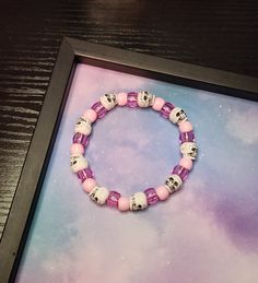 Punk af! But like, in a pretty way. Colors used: pastel pink, translucent pink, white Made plastic beads on a stretch cord. Each bracelet is approximately 7.5 inches around but can be adjusted to other lengths if needed. Just send me a message with the length required at the time of purchase and I'd be happy to make the adjustment. Want to order multiples? No problem! Please contact me before placing an order to ensure I have all the supplies required :) White Rave Beaded Bracelets For Friendship, White Rave Bracelets Gift, Trendy White Plastic Bracelets, Trendy White Plastic Bracelet, White Adjustable Rave Jewelry, Handmade White Beaded Rave Bracelets, White Handmade Beaded Bracelets For Rave, White Adjustable Beaded Rave Bracelets, Adjustable White Beaded Bracelets For Rave