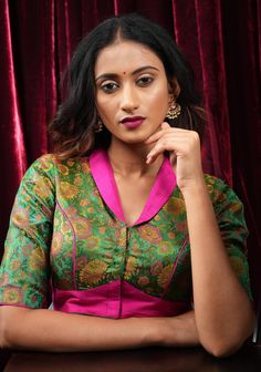 Indulge in opulent fashion with our Green Tanchoi and Fuchsia Satin Blouse, expertly crafted with a stunning lapel collar design that lends a neo-ethnic tough to your saree ensemble! Need minor customizations such as altering the sleeve length or neckline? Or if you are looking for a custom size. Ask us and we will try our best to make it happen! SIZE GUIDE : To determine your blouse size, please measure around the fullest part of your bust line using a measuring tape. Your bust measurement will Collar Neck Blouse, ब्लाउज बैक नेक डिजाइन, Blouse For Saree, House Of Blouse, Blouse Designs High Neck, Sari Design, Satin Bluse, Fashion Sarees, Sari Blouse