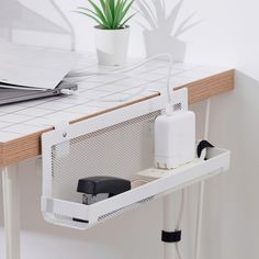 a computer desk with a laptop on it