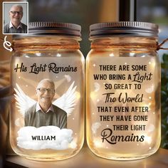 there are two mason jars with the same image on them, one has an angel in it