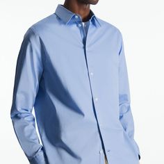 Cos Regular Fit Poplin Shirt Size: 14 1/2 Color: Light Blue Nwt This Light-Blue Organic Cotton-Poplin Shirt Is As Classic As They Come. Designed For A Regular Fit, It's Tailored With A Sharp Pointed Collar, Cuffed Long Sleeves And A Subtly Curved Back Hem That'll Tuck Neatly Into Pants. The Tonal Buttons And Minimal Topstitching Are Streamlined Finishing Touches. - Button Closure - Organic Cotton Is Grown From Non-Genetically Modified Seeds Without Chemical Fertilizers Or Pesticides 100% Organic Blue Cotton Dress Shirt For Business Casual, Blue Cotton Dress Shirt For Spring, Blue Cotton Business Shirt, Blue Relaxed Fit Dress Shirt For Spring, Long Sleeve Poplin Shirt With Button Closure, Blue Dress Shirt With Fold-down Collar For Business Casual, Smart Spring Shirt With Button Closure, Modern Blue Shirt For Formal Occasions, Spring Business Casual Shirt With Fold Down Collar