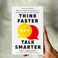 a person holding up a book with an image of two speech bubbles on it, and the title think faster talk smarter