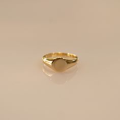 Sleek gold vermeil signet ring - timeless elegance for any look! 🌟 Perfect for you or as a special gift! 🎁💛 Check what's cool about it 😎 ✨Made from sterling silver with gold vermeil plating ✨Minimalist oval shape, approximately 1/2 inch wide ✨Versatile stackable ring or wear alone as a statement piece ✨Makes a thoughtful gift for any occasion ✨Please note, due to the nature of gold vermeil, some gradual wear over time is to be expected with regular use. We recommend gentle care to help prese Timeless Gold Stackable Rings As Gift, Gold Dome Ring With Smooth Bezel In 14k Gold, Gold Plated Timeless Signet Ring, Timeless Gold-plated Signet Ring, Adjustable Yellow Gold Signet Ring For Everyday, Classic Gold Initial Ring For Everyday, Modern Gold Signet Ring Stamped 14k, Timeless Gold Oval Stackable Rings, Minimalist 14k Gold Dome Ring Tarnish Resistant