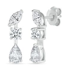 Explore sparkle, style and detail in these round, marquise-cut and pear-shaped white lab-created sapphire station drop earrings. Fashioned in sterling silver Each linear drop shimmers with a trio of white lab-created sapphires - a tilted marquise-cut post, a round center stone and the largest 6.0 x 4.0mm pear-shaped stone at the base. These earrings secure comfortably with friction backs. White Lab, Peoples Jewellers, Marquise Cut, Round Earrings, Pear Shaped, Sterling Silver Earrings, Pear, Sapphire, Lab