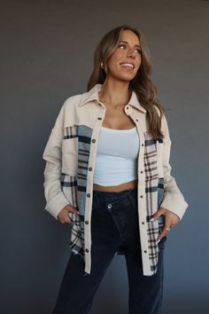 DETAILS: Our Kalen Contrast Plaid Shacket is a lightweight shacket with unique details throughout. This all over cream cotton shacket features a snap closure, teal plaid pattern throughout the bodice, and oversized fit. The cuffs of this shacket are completed with a snap closure. The front of this jacket is completed with a cream contrasting neckline and pocket details, raw hemline, and full length fit. This jacket has a boxy fit and runs true to size. SIZE & FIT: Model is 5'6" The model is wear Teal Plaid, Plaid Shacket, Pocket Detail, Plaid Pattern, Snap Closure, Bodice, Full Length, Plaid, Cream