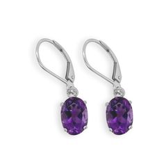 If purple is your color then look no further. These petite oval shaped Amethyst earrings with a total weight of 1.33 carats are a deep purple but not so dark that you can’t see the wonderful faceting. They dangle approximately 1 inch and have lever backs so they will stay securely in your ears, allowing you to wear them every day.Fun Fact: Amethysts are said to provide a shield around your body against low energy. Specifications: Sterling silver Amethyst 1.33 ctw Length 1 inch Purple Oval Earrings With Gemstone Accents, Oval Amethyst Earrings With Gemstone Accents, Classic Oval Earrings With Gemstone Accents, Classic Teardrop Purple Earrings, Classic Purple Drop Earrings, Silver Spinner Rings, Sapphire Color, Amethyst Earrings, Low Energy