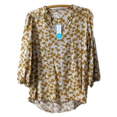 New Stitch Fix Gold Cream Floral Ruffle Neck 3/4 Sleeve Blouse Size M Cottagecore Top Like An Item But Not The Price? Send Me An Offer Buy With Confidence, I Am A 5 Star Seller, Poshmark Level Ii Ambassador With Many Happy Customers All Items Are From My Personal Closet, New With Tags Or Like New & Well Cared For Look For Closet Clear Out Days Bundle 2 Or More Items For Best Deals And Discounts To Save Not On Poshmark? Use My Code: Marleymaggiemae To Receive A *$10 Credit From Poshmark When You Spring Rayon Top With Split Neck, Casual Rayon Blouse With Split Neck, Relaxed Fit Floral Print Viscose Blouse, Spring Viscose Blouse In Relaxed Fit, Spring Viscose Blouse With Relaxed Fit, Relaxed Fit Viscose Blouse With Floral Print, Casual Viscose Top With Split Neck, Fitted Split Neck Summer Blouse, Fall Split Neck Top With Relaxed Fit