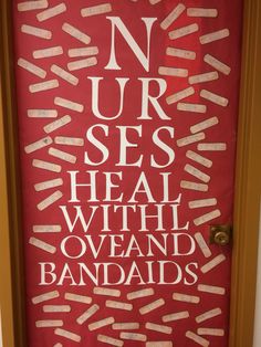 a red door with white writing on it that says no ur ses heal with oveand bandages