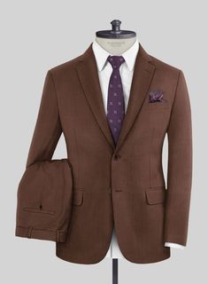 Everytime a brown suit was put to a test, it passed with flying colors. Crafted from 100% wool, our Scabal Brick Brown Wool suit is a wardrobe essential for timeless styling, which has been gently milled to give a soft superior feel. Wear this sleek suit to special occasions, whether you're headed to work or looking to add some class to your everyday outfits for years to come. Simply pair it up with a matching waistcoat, white shirt, maroon tie and black shoes to seal the ensemble.   Look Includes  Scabal Brick Brown Wool Fabric  Two Button Jacket Style  Notch Lapel  Real Horn Brown Buttons  Single Vent  Three Cuff Buttons  Two Welted Back Pockets on Trousers    You can change the look during customization if required.   Weight: Light Weight/260gr, Lining: 100% Viscose, Dry Clean. Fitted Brown Suits For Formal Occasions, Brown Fitted Formal Suits, Semi-formal Brown Double Breasted Suit, Brown Three-piece Suit For Formal Occasions, Formal Fitted Brown Suits, Formal Brown Three-piece Suit, Elegant Fitted Brown Blazer, Tailored Brown Three-piece Formal Suit, Tailored Brown Three-piece Suit For Formal Occasions