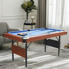 a pool table in the middle of a living room