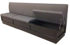 a black couch with two separate seats and a pull out table on the bottom shelf