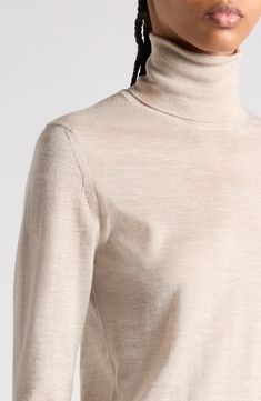 Tom Ford's tasteful elegance pervades this trim turtleneck sweater knit in Italy from silk-softened cashmere with finely ribbed trim. 23 1/2" length (size Medium) Turtleneck Long sleeves Ribbed cuffs and hem 70% cashmere, 30% silk Dry clean Made in Italy Designer Clothing Elegant Beige Winter Turtleneck, Elegant Beige Turtleneck For Winter, Elegant Merino Wool Fine Knit Tops, Elegant Formal Merino Wool Tops, Elegant Fine Knit Merino Wool Tops, Elegant Wool Turtleneck For Winter, Elegant Cashmere Sweater With Funnel Neck, Luxury Fitted Merino Wool Top, Luxury Fine Knit Formal Sweater