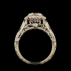 an antique style diamond ring on a black background