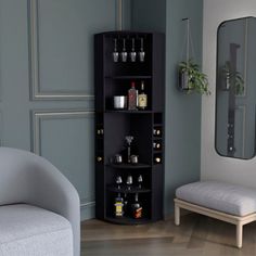 a corner shelf with liquor bottles and glasses on it in the corner of a living room