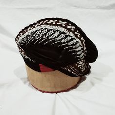 a black and white hat sitting on top of a table