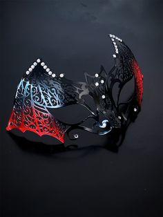 Our women's bat metal masquerade mask, adorned with red accents and sparkling rhinestones, is your key to a night of gothic enchantment and timeless beauty. Designed for hours of comfortable wear, so you can dance and mingle with ease. Whether you're attending a gothic masquerade ball or simply looking to make a dramatic entrance, this mask ensures you'll be the center of attention.


Age Group/Gender - Adult/Women

Size/Type - One size fits all adults

Mask Color - Red/Black

Mask Material - La Gothic Masquerade Mask For Carnival Evening, Red Masquerade Mask For Halloween Cosplay, Gothic Masquerade Mask For Halloween Evening, Red Fantasy Party Mask, Red And Black Masquerade Mask, Halloween Masks Scary, Gothic Masquerade, Masks Scary, Masquerade Mask Women