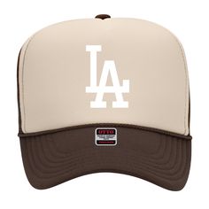 a white and brown los angeles dodgers baseball cap with the word la on it's front