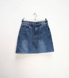 "a vintage blue denim mini-skirt ✿ IMPORTANT INFORMATION: * excellent vintage condition * material: 100% cotton * size: small - please check exact measurements below (they're there for your benefit!) * garment care: machine washable ✿ MEASUREMENTS (taken while item is lying flat, some measurements will need to be doubled): * waist: 13.5\" (34cm) * hips: 18\" (46cm) * length: 16.5\" (42cm) ✿ free UK shipping on orders over £100 with code STRAWBERRY free international shipping on orders over £250 Cheap 90s Mini Denim Skirt, High Waist Blue Mini Skirt Retro Style, Retro Denim Mini Skirt, Denim Blue Mini Denim Skirt, Retro Denim Mini Skirt For Summer, Retro Blue Denim Mini Skirt, Vintage High Waist Denim Mini Skirt, High Waist Vintage Denim Mini Skirt, Denim Blue Mini Skort