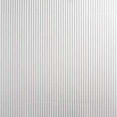 a white wall with vertical lines on it