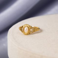 Our Vintage Royal Pearl Ring is a vintage-inspired dream come true. Crafted with stunning freshwater pearl, this beautiful piece is guaranteed to be a wardrobe essential for years to come. Pearl Rings Vintage, Pearl Rings, Cute Engagement Rings, Gold Pearl Ring, Gold Rings Fashion, Jewelry Lookbook, Jewelry Ring Box, Earrings Dangle, Gold Pearl