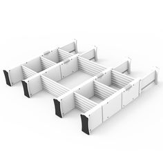 three white boxes with black trims on each side and one in the middle, all facing different directions