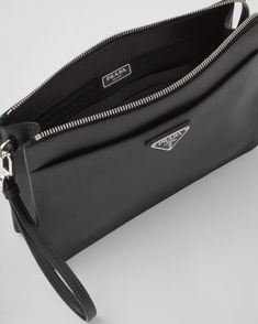 Detachable leather wrist strap Enameled metal triangle logo on the front Zipper closure Two external pockets with magnet Interior with card slots Prada logo nylon lining Prada Logo, Prada Saffiano, Triangle Logo, Leather Wristlet, Leather Pouch, Wrist Strap, Leather Belt, Front Zipper, Card Slots