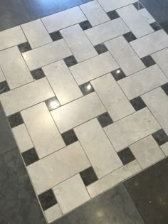 a tiled floor with black and white squares on it