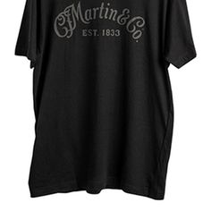 Hey, Martin Guitar fans, this black-on-black tee is perfect for any  occasion. It's made from 100% ringspun cotton, so it's going to be super  comf... Black Band Logo T-shirt In Relaxed Fit, Black Band Logo T-shirt Relaxed Fit, Black Band Logo T-shirt With Relaxed Fit, Black Relaxed Fit T-shirt With Band Logo, Martin Guitar, Tone On Tone, Logo T Shirt, Tshirt Logo, Black Tee