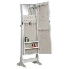 a white jewelry cabinet with its door open