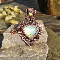 "This stunning pendant features a gorgeous green Labradorite teardrop cabochon encapsulated in genuine copper gallery wire with a lime Cubic Zirconia accent in the bail. The pendant is hand wrapped in square copper wire then antiqued and polished to highlight the details and create an elegant finish and can be supplied with or without a genuine antiqued copper chain. The pendant and chain have been treated with Renaissance Wax, an invisible protective finishing wax, to prevent further oxidisatio Green Copper Round Pendant Jewelry, Electroformed Teardrop Pendant Jewelry Gift, Unique Copper Teardrop Pendant Jewelry, Green Gemstone Copper Jewelry, Unique Copper Teardrop Jewelry, Green Gemstone Jewelry In Copper, Green Copper Gemstone Jewelry, Hand Forged Green Teardrop Jewelry, Green Labradorite Teardrop Jewelry