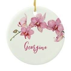 a ceramic ornament with pink orchids and the word, georgia on it