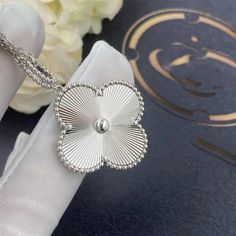 Discover the elegance and simplicity of the Clover Silver Big Clover Necklace. Crafted with a beautiful silver finish and featuring a striking clover design, this necklace is a versatile and stylish addition to any outfit. Elevate your look with this timeless piece. ADDITIONAL INFORMATION Color: silver Stone: cubic zirconia Ref. 5221 Material:- 925 Sterling Silver - 18k Gold Plated- 18k Real Gold ( contact us via instagram) Our replica products are committed to quality and color when used. They Elegant Silver Necklace With Flower Shape, Elegant Necklaces With Flower Pendant And Polished Finish, Refined White Gold Sterling Silver Necklace, Classic Silver Necklace With Flower Shape, Refined Silver Necklace With Polished Finish, Luxury White Gold Flower Shaped Necklace, Luxury Flower-shaped Clavicle Chain Jewelry, Refined Silver Pendant Necklace, Refined Silver Round Pendant Necklace