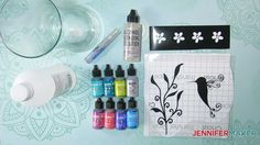 an assortment of crafting supplies including markers, pens and inks on a table