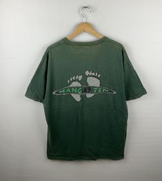 *ITEM: Vintage 90s Hang Ten  Surfing Surfer Tee Large Vintage 1990s Hangten Rare Iconic Surf California  Surf Tee Tshirt Green Size L              *ITEM DETAILS: 👇🏻 Please be aware that all vintage items will usually show a few signs of wear or fading due to age, but anything visible such as stains or holes, and serious flaws have been photographed.For any further information on this item please contact us and we will be happy to help. *SIZE: LARGE  * ACTUAL SIZE MEASUREMENT: 👇🏻 *PIT TO PIT( 90s Green T-shirt For Streetwear, 90s Style Green T-shirt For Streetwear, 90s Green T-shirt With Logo Print, 90s Style Green T-shirt With Logo Print, Vintage Surf Wear, Surfer Clothes, Surf California, Surf Tee, California Surf