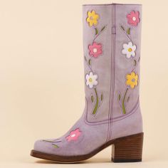 Elevate your style with these vintage lavender cowgirl boots featuring intricate floral designs. The mid-calf height and sturdy block heel offer both fashion-forward flair and comfortable wear for any occasion. Color: Lavender Heel Type: Block heel Heel Height: 2.36" / 60 mm approx Shaft Height: 11.81'' / 300 mm approx Product measurements were taken using size 8. Please note that measurements may vary by size. Toe: Square toe Flower blossom design Pull-on design Handcrafted US sizing. Fits true to size. Purple Cowboy Boots, Lavender Heels, Retro Boots, Flower Boots, Vintage Lavender, Funky Shoes, Lavender Flower, Purple Tulips, Mode Chic