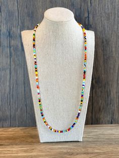 African Beaded Necklace This vibrant mix of colors creates the perfect accessory for him or her. Made of stunning colorful African love beads, (some may call tribal beads, christmas beads, ghana beads, rainbow seed beads or vintage glass beads), this necklace looks great worn in any length from a choker to a longer strand. Choose the length and clasp of your choice. Some prefer to get this necklace without a clasp for easy on, easy off. For this option I recommend 25 inches or more to make sure Colorful Multi-strand Beaded Necklaces As Gifts, Colorful Multi-strand Beaded Necklace For Festivals, Colorful Multi-strand Beaded Necklace As Gift, Colorful Multi-strand Beaded Festival Necklaces, Bohemian Rainbow Beaded Necklaces, Adjustable, Ghana Beads, Beaded Rainbow, African Beaded Necklace, Christmas Beads