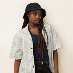 Discover the Ultimate Summer Wardrobe Essential: The All-Over Print Collared Unisex Button-Down Shirt! 🌟 👕 **Ultra-Comfortable & Stylish Dive into summer with flair in our All-Over Print Collared Unisex Button-Down Shirt. Designed to impress and built for comfort, this shirt is your perfect companion for every summer adventure. With a blend of 65% recycled polyester and 35% polyester, it offers a sustainable choice without compromising on style. 🌞 **Beat the Heat Say goodbye to discomfort on Casual Button-up Blouse With Graphic Print, Cotton Button-up Blouse With Graphic Print, Cotton Short Sleeve Button-up Shirt For Day Out, Trendy Cotton Short Sleeve Shirt With Camp Collar, Retro Collared Shirt For Day Out, Trendy Cotton Top With Camp Collar, Camp Collar Tops With Buttons For Day Out, Graphic Print Button-up Shirt For Day Out, Retro Cotton Shirt For Day Out