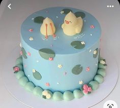 there is a cake that has two ducks in the water