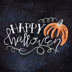 a chalkboard with the words happy halloween written on it and an orange pumpkin in the center