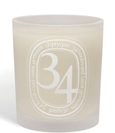 a white candle with the number 34 on it's front and back side,