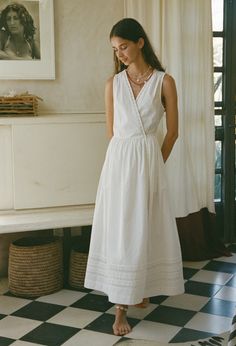 The Maja Dress in white is an embroidered cotton sleeveless midi wrap dress. Fit: True to Size. Model wears size small. Sizing: XXS-XL Materials: 100% Cotton White Linen Midi Dress, White Dress Beach Outfit, Bridal Fits, Linen Dress Outfit, White Linen Dress Summer, Summer Prep, Ciao Lucia, Loose Summer Dress, Linen Outfit