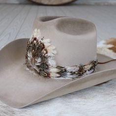 1 Unit Width: 3 cm Length: approx. 58cm (not including leather ties) One size fits most. Adjustable with leather ties. Hat not included. Center crest measures 5" W x 4.5" H. CA Residents: Prop 65 Warning ↗️ Feathered Cowboy Hat Band, Feather Hat Band, Cowgirl Hats Western, Cowboy Hat Design, Custom Cowboy Hats, Cowboy Hat Bands, Silver Hats, Beaded Hat Bands, Beaded Hat