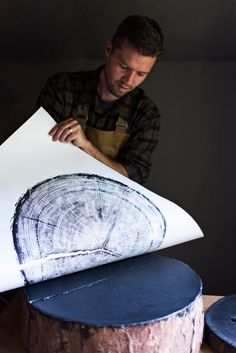 a man is working on a piece of wood that has been cut into smaller pieces